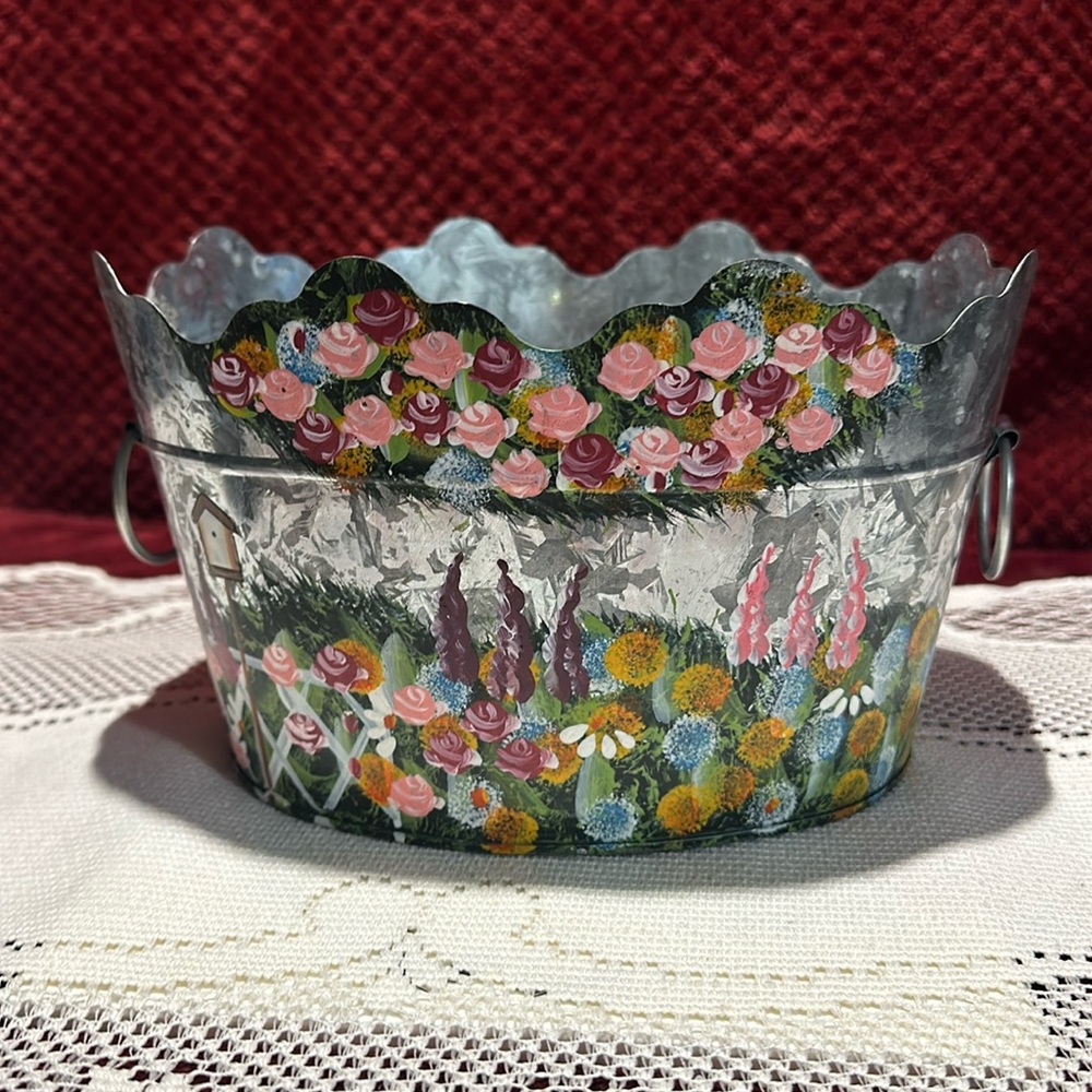 Hand painted floral garden design, Metal basket oval, ring handles.